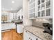 Modern kitchen with white cabinetry, granite countertops, and stainless steel appliances at 2309 Laurelford Ln, Wake Forest, NC 27587