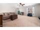 Spacious living room with comfortable seating, carpeted floor and natural light at 2309 Laurelford Ln, Wake Forest, NC 27587