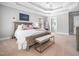 Serene main bedroom featuring tray ceiling, soft carpet, and neutral color palette at 2309 Laurelford Ln, Wake Forest, NC 27587