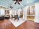 Charming sunroom with wood floors, neutral rug and views of the surrounding nature at 2309 Laurelford Ln, Wake Forest, NC 27587