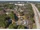 A neighborhood aerial view that shows the proximity to the highway and the surrounding trees at 2311 Glover Rd, Durham, NC 27703