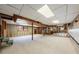 An unfinished basement with concrete floors and exposed beams at 2311 Glover Rd, Durham, NC 27703
