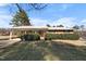 Charming brick home with a covered carport and well-maintained landscaping at 2311 Glover Rd, Durham, NC 27703