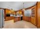 Spacious kitchen with wood cabinetry, breakfast bar, and classic appliances at 2311 Glover Rd, Durham, NC 27703