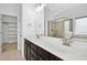 Bathroom vanity with double sinks, bright lights and a frameless shower at 2505 Mt Zion Church Rd Rd, Apex, NC 27502