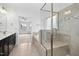 Bright bathroom features a glass shower, tile floors, and an adjacent carpeted room at 2505 Mt Zion Church Rd Rd, Apex, NC 27502