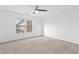 A bright room with a ceiling fan and a large window at 2505 Mt Zion Church Rd Rd, Apex, NC 27502