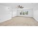 A bright room with a ceiling fan and a bank of windows at 2505 Mt Zion Church Rd Rd, Apex, NC 27502