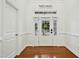 A bright foyer with hardwood floors and a view of the front yard through the door at 2505 Mt Zion Church Rd Rd, Apex, NC 27502