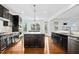 Spacious kitchen with granite countertops, dark cabinets, and stainless steel appliances at 2505 Mt Zion Church Rd Rd, Apex, NC 27502