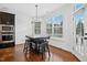 Bright eat-in kitchen boasts hardwood floors, a pendant light fixture, and stainless steel appliances at 2505 Mt Zion Church Rd Rd, Apex, NC 27502