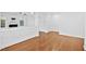 Open-concept living room with hardwood floors and an adjacent hallway at 2505 Mt Zion Church Rd Rd, Apex, NC 27502