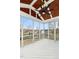 Covered screened porch featuring a wood ceiling, ceiling fan, and white wood floors and railings at 2505 Mt Zion Church Rd Rd, Apex, NC 27502