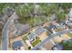 An aerial view of beautiful homes nestled around a serene pond and surrounded by lush trees in a lovely neighborhood at 2639 Bowden Dr, Creedmoor, NC 27522