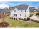 Exterior view of the back of the house with a well-maintained yard at 2639 Bowden Dr, Creedmoor, NC 27522