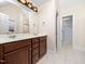 Bathroom vanity featuring double sinks and a large mirror at 2639 Bowden Dr, Creedmoor, NC 27522