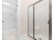 Bathroom shower with sliding door and walk-in closet at 2639 Bowden Dr, Creedmoor, NC 27522