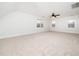 Large bright bedroom featuring neutral walls, carpet flooring, a ceiling fan and three windows at 2639 Bowden Dr, Creedmoor, NC 27522