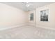 Bedroom with carpet flooring and two windows with blinds at 2639 Bowden Dr, Creedmoor, NC 27522