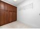 Walk-in closet with custom wood cabinets and shelving at 2639 Bowden Dr, Creedmoor, NC 27522