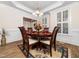 Formal dining room featuring a wooden table, upholstered chairs, and sophisticated decor at 2639 Bowden Dr, Creedmoor, NC 27522