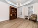 Dining room with tray ceiling and decorative shelving unit at 2639 Bowden Dr, Creedmoor, NC 27522