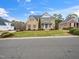Inviting two-story home with brick facade, lush lawn, and beautifully landscaped front yard at 2639 Bowden Dr, Creedmoor, NC 27522