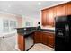 This kitchen features stainless steel appliances, granite countertops, and wooden cabinets at 2639 Bowden Dr, Creedmoor, NC 27522
