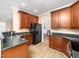 Kitchen with wood cabinets, granite countertops and stainless sink at 2639 Bowden Dr, Creedmoor, NC 27522