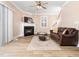 Inviting living room with fireplace, ceiling fan, and comfortable seating arrangement at 2639 Bowden Dr, Creedmoor, NC 27522