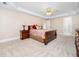 Spacious main bedroom with tray ceilings and carpet at 2639 Bowden Dr, Creedmoor, NC 27522