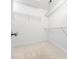 Bright walk-in closet with white walls, carpet and wire shelving for optimal storage and organization at 2639 Bowden Dr, Creedmoor, NC 27522
