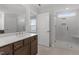 Modern bathroom featuring a double vanity, a glass-enclosed shower, and ample natural light at 3016 Dog Rose Dr # 303, Durham, NC 27703
