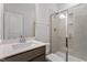 Bathroom featuring modern vanity with double sink and shower with glass door at 3016 Dog Rose Dr # 303, Durham, NC 27703