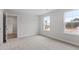 Bright bedroom with carpet, white walls, and natural light from two windows at 3016 Dog Rose Dr # 303, Durham, NC 27703