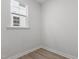 A bright bedroom featuring wood floors and natural light streaming through a window at 3016 Dog Rose Dr # 303, Durham, NC 27703