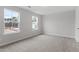 Bright bedroom with carpet and two windows providing natural light at 3016 Dog Rose Dr # 303, Durham, NC 27703