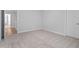 Bedroom with carpet flooring and open doorway at 3016 Dog Rose Dr # 303, Durham, NC 27703