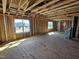 Framing reveals the layout of this new home with window views to the outside at 3016 Dog Rose Dr # 303, Durham, NC 27703