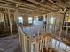 Upstairs framing showcasing window placement and overall construction of the new home at 3016 Dog Rose Dr # 303, Durham, NC 27703