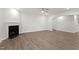 Living room with a fireplace and hardwood flooring; light and airy space at 3016 Dog Rose Dr # 303, Durham, NC 27703