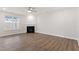 Cozy living room with a fireplace, lots of natural light, and open concept design at 3016 Dog Rose Dr # 303, Durham, NC 27703