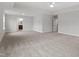 A spacious main bedroom with plush carpet, tray ceiling, and two entry doors, one to the bathroom at 3016 Dog Rose Dr # 303, Durham, NC 27703