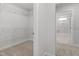 Spacious walk-in closet with carpet flooring and wire shelving throughout at 3016 Dog Rose Dr # 303, Durham, NC 27703