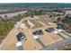 An aerial view of multiple new homes set on large lots with trees and a small lake at 3131 Pilson Rd, Cameron, NC 28326