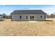 Rear view of a home with a well-maintained backyard at 3131 Pilson Rd, Cameron, NC 28326