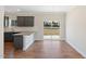 Dining area with stylish chandelier, wood floors, and sliding glass doors leading to the backyard at 3131 Pilson Rd, Cameron, NC 28326