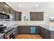 U-shaped kitchen showcases stainless steel appliances, granite countertops, and ample cabinet space at 3131 Pilson Rd, Cameron, NC 28326