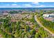 Aerial view of a condo complex surrounded by lush trees and a highway at 32 Melstone Turn, Durham, NC 27707