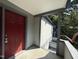 View of the front porch showcasing the red front door of the home at 32 Melstone Turn, Durham, NC 27707